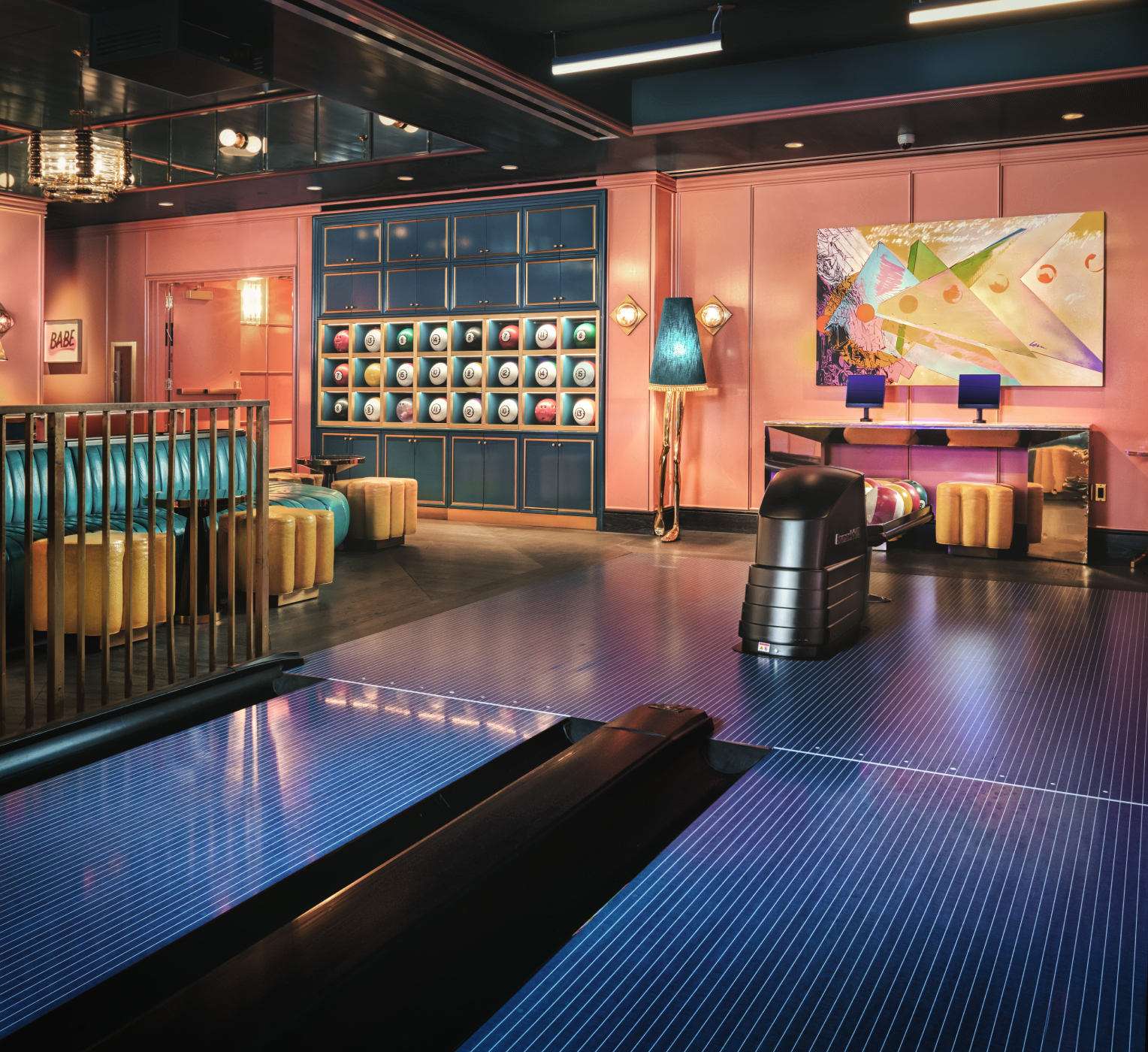 Modern lounge interior with colorful lighting, contemporary furniture, and artistic decor